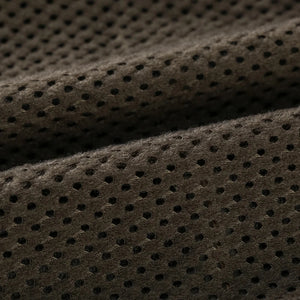 Close-up of brown perforated fabric texture
