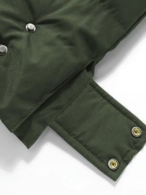 Close-up of a green jacket with buttons on a white background