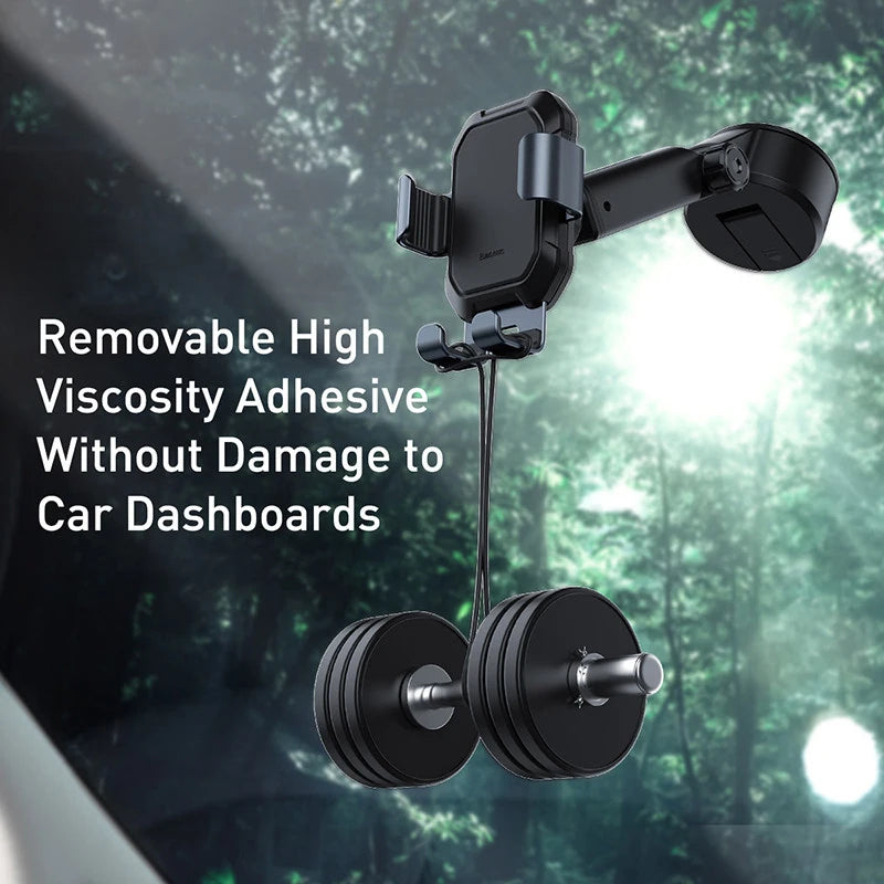 Car phone mount with removable high viscosity adhesive on a car dashboard with a forest background.