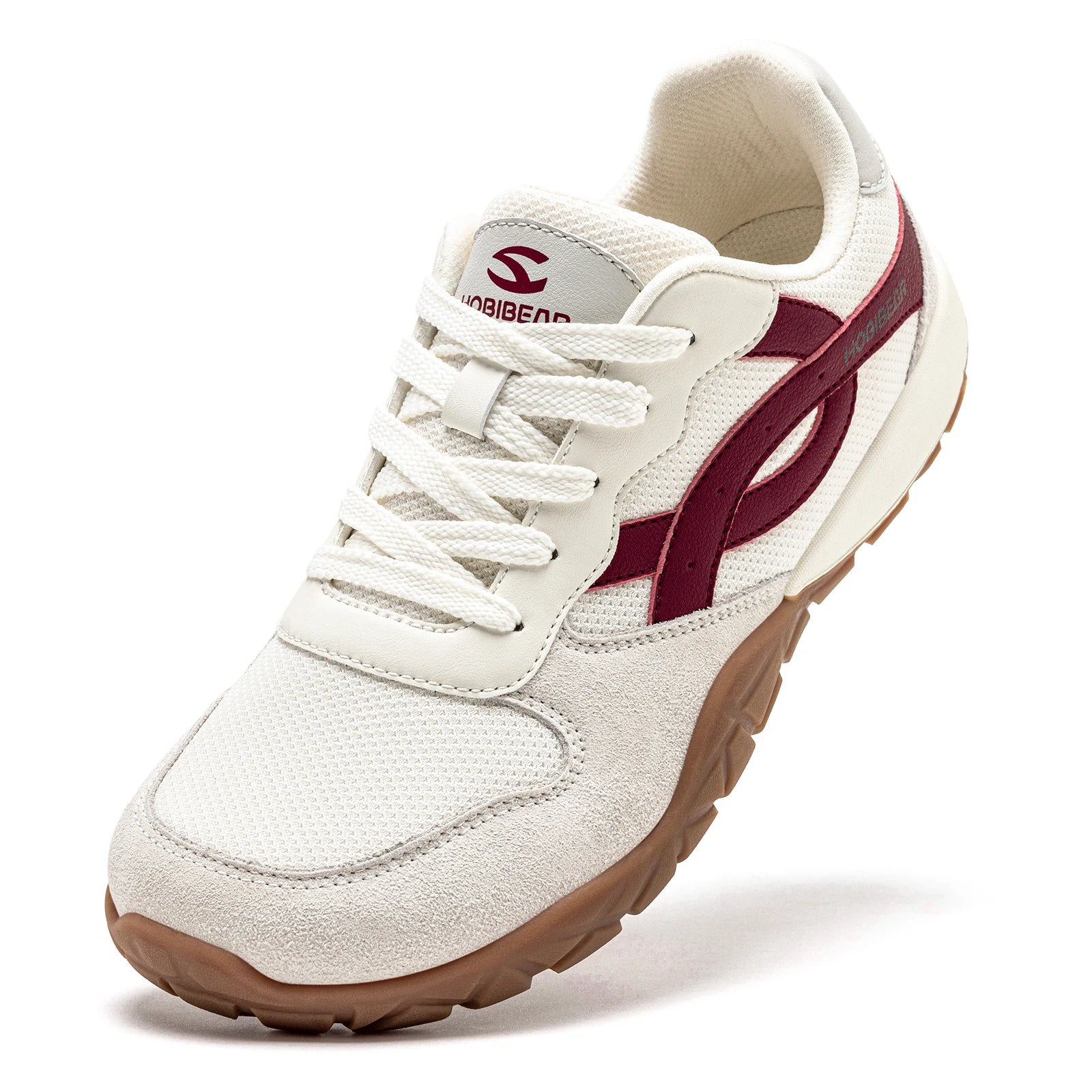 White sneaker with maroon accents on a white background