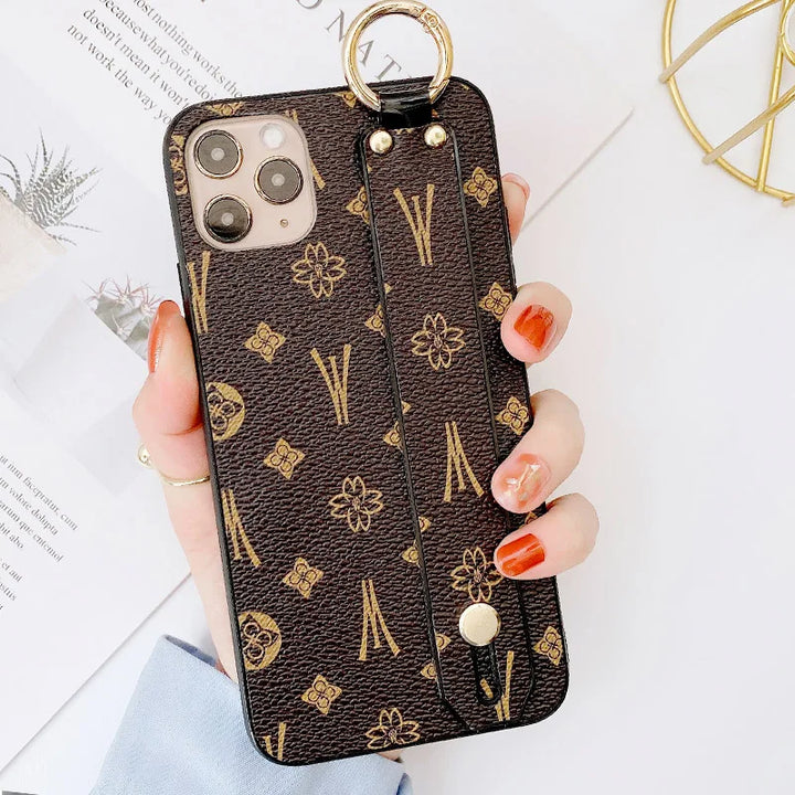 Luxury leather wristband phone case for iPhone, featuring jeweled and fabric designs, durable and stylish.