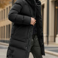 Man wearing a black puffer jacket in an urban setting