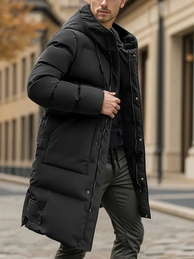 Man wearing a black puffer jacket in an urban setting