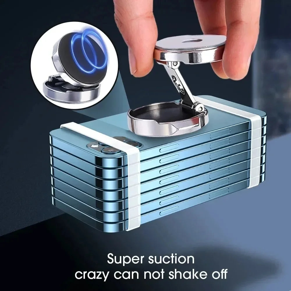 Metallic device with suction cup being held by a hand on a dark background