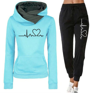Light blue hoodie and black jogger pants with heart and line design on a white background