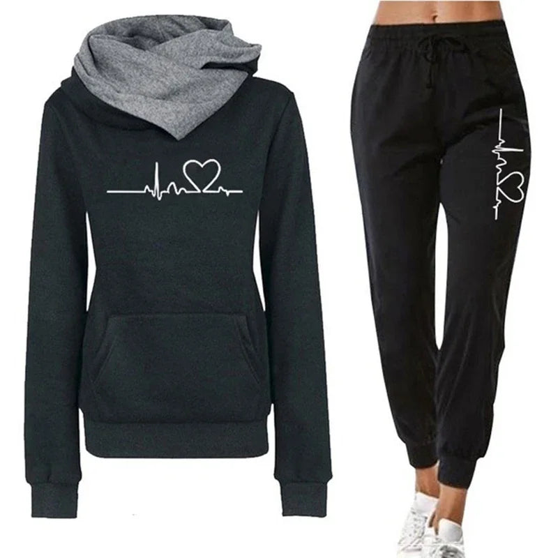 Black hoodie and jogger set with heart and heartbeat design on a white background