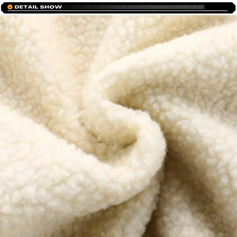 Close-up of beige fleece fabric with a brand logo at the top.