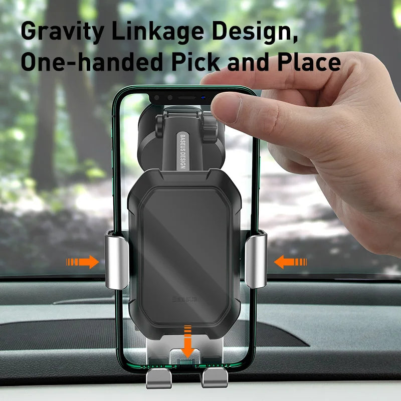 Hand holding a phone in a car mount with text 'Gravity Linkage Design, One-handed Pick and Place' against a blurred outdoor background.