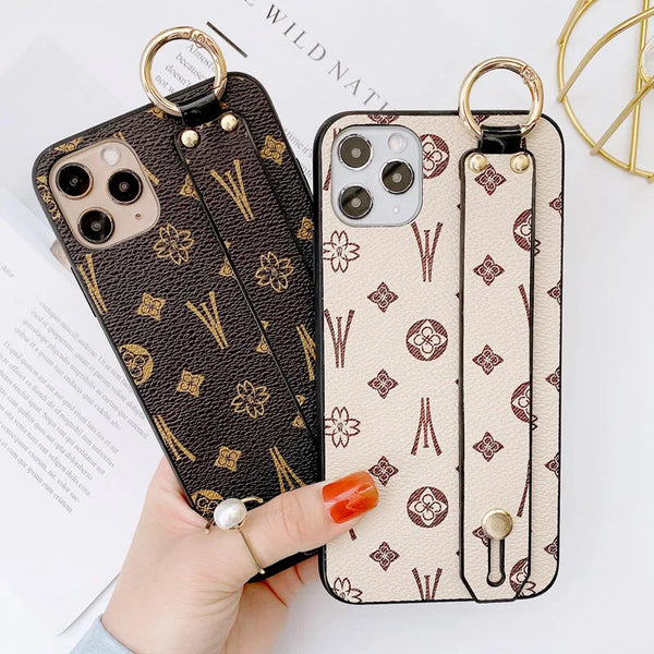 Luxury leather wristband phone case for iPhone, featuring jeweled and fabric designs, durable and stylish.
