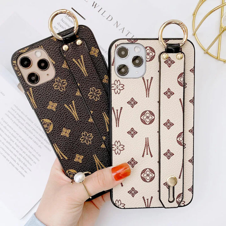 Luxury leather wristband phone case for iPhone, featuring jeweled and fabric designs, durable and stylish.