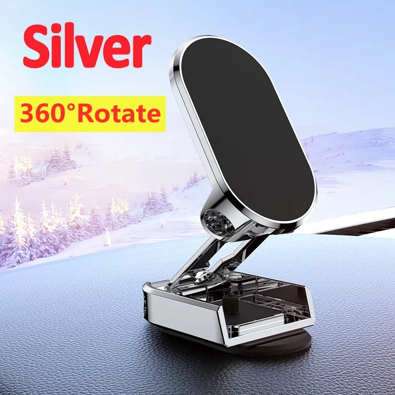 Silver 360-degree rotate phone holder on a car dashboard with snowy landscape background