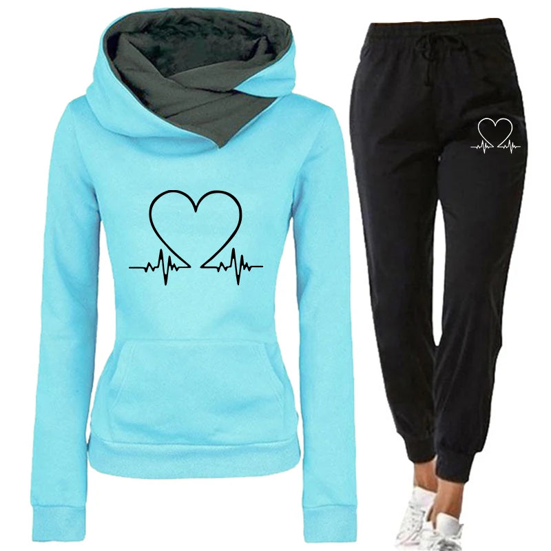 Light blue hoodie and black jogger pants with heart design on a white background