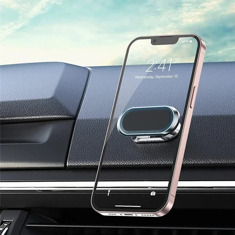 Smartphone with a protective glass screen on a car dashboard